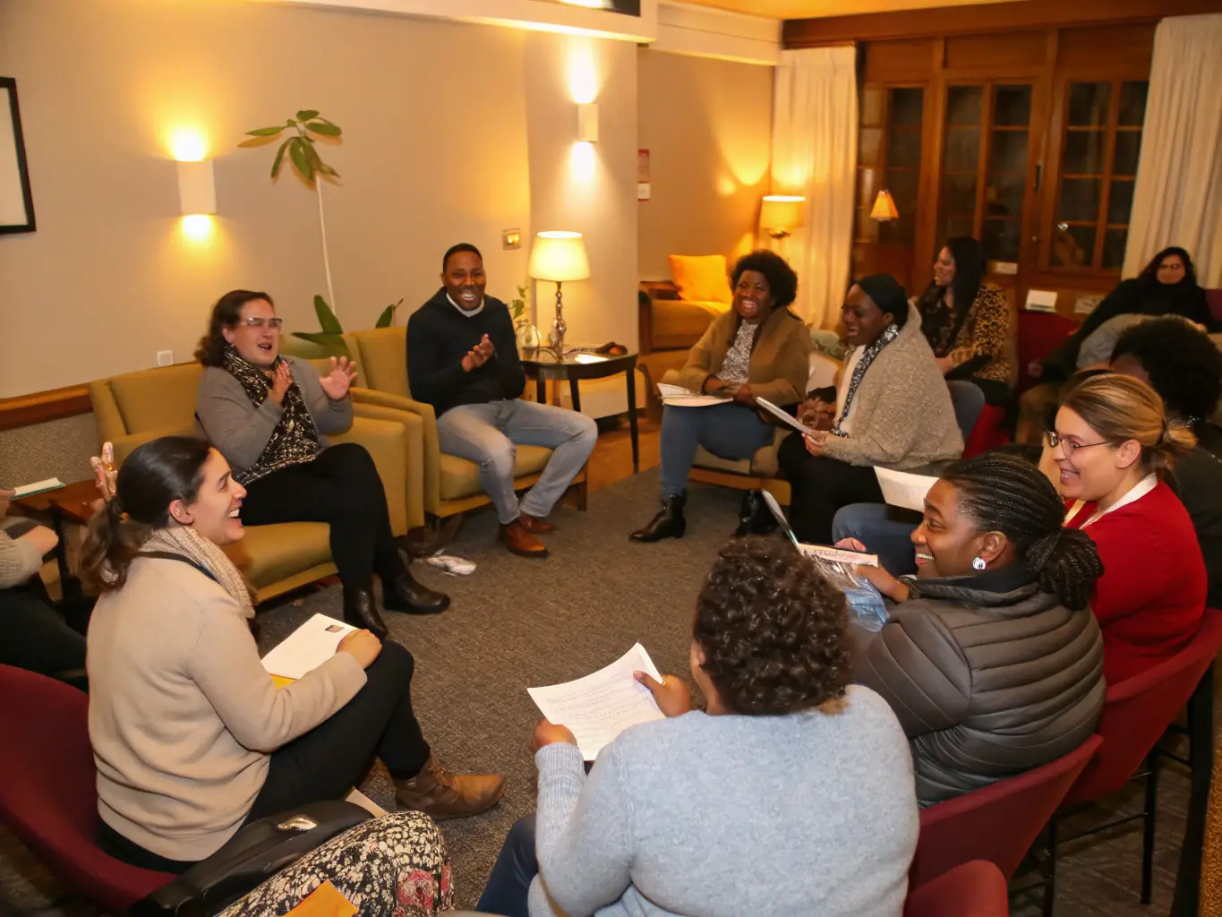 A group of adults participating in a support group session, sharing experiences and providing mutual support in a comfortable setting.